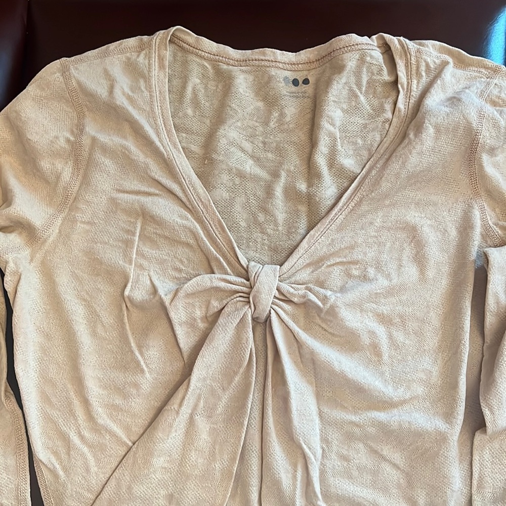 Three quarter sleeve tee with a ruched neckline